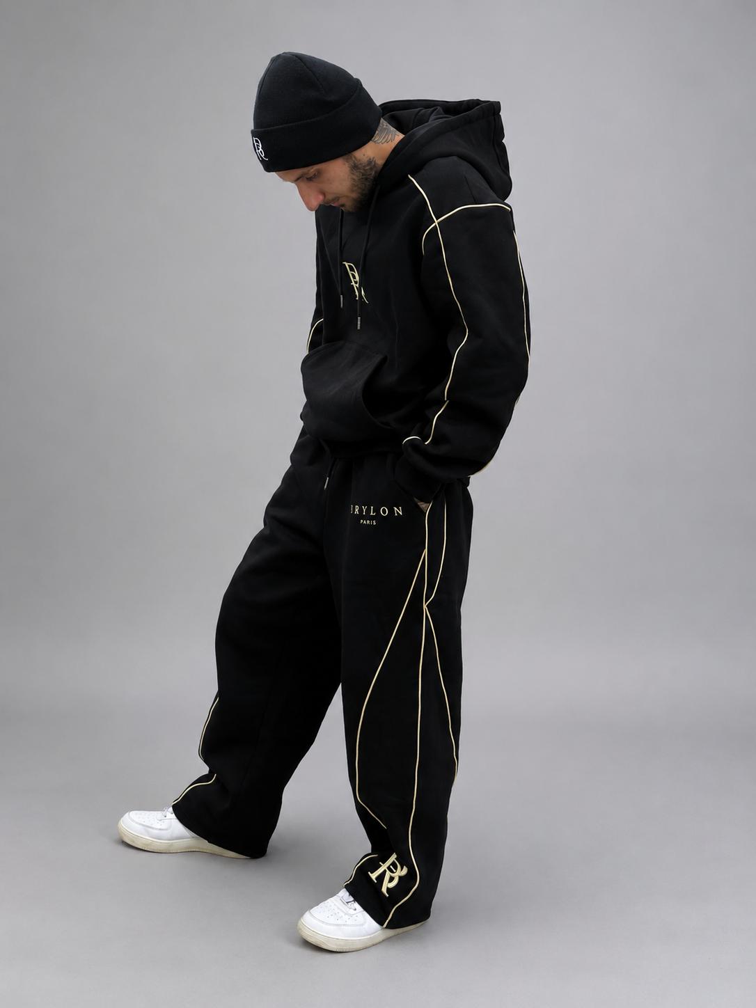 Ensemble Élite 2026 noir BRYLON PARIS porté par un homme en tenue streetwear