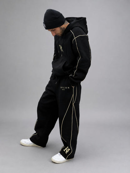 Ensemble Élite 2026 noir BRYLON PARIS porté par un homme en tenue streetwear